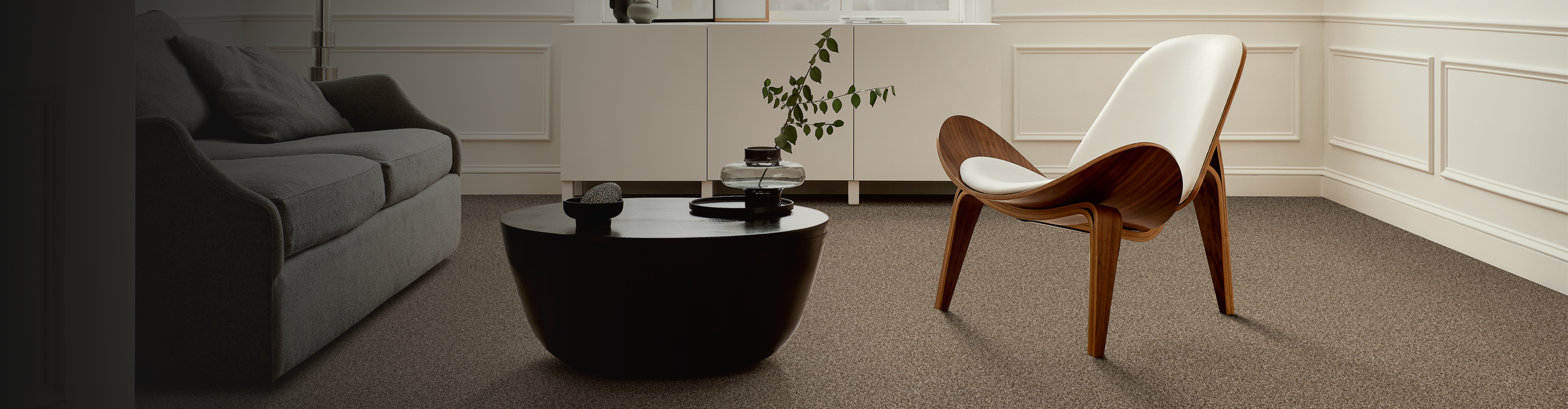 Living room with wooden chair and beige carpet